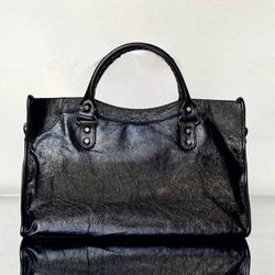 A black Balenciaga bag