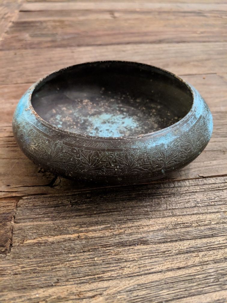 Metal dish with patina