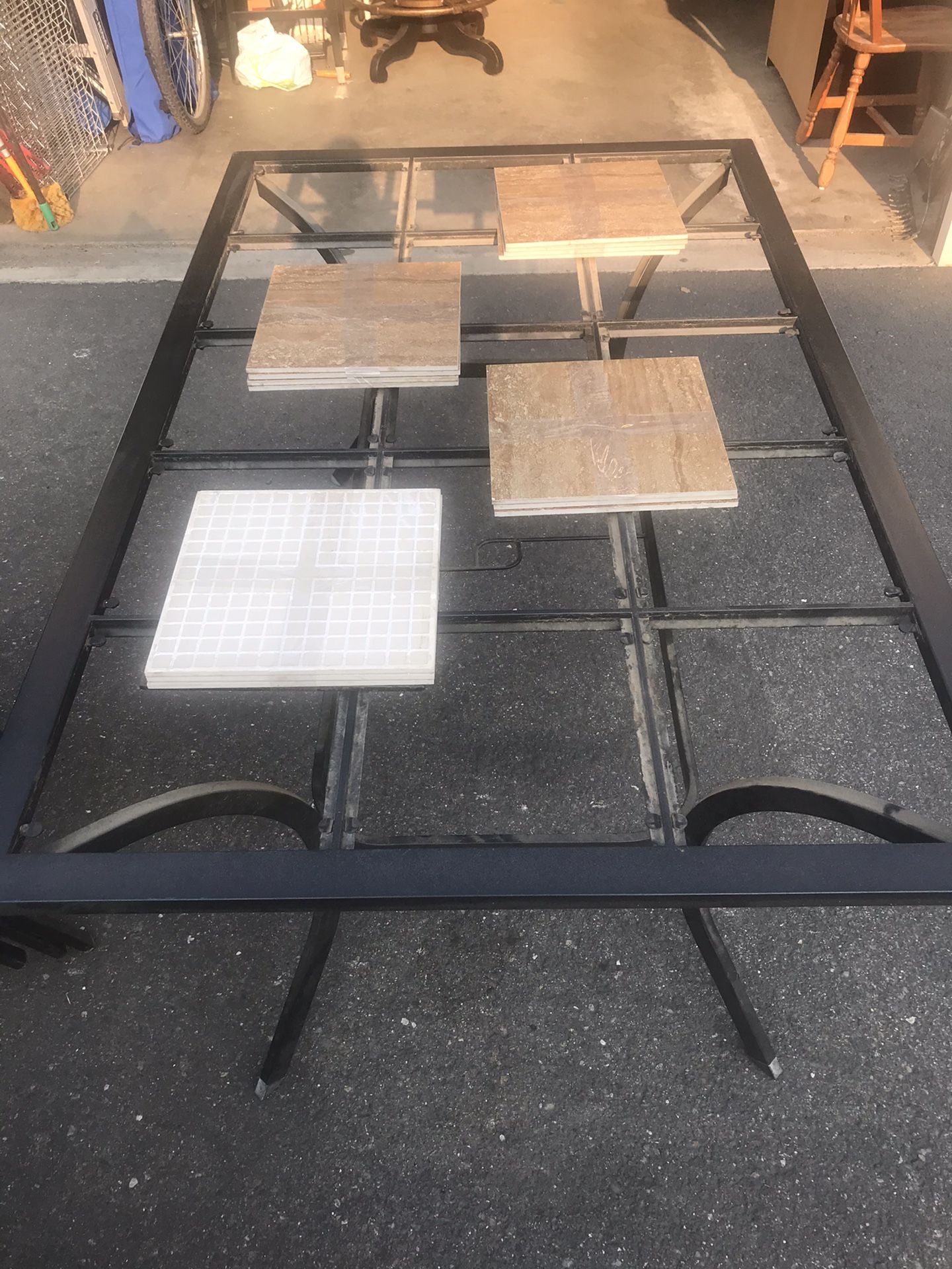 Outdoor patio dining table and 6 chairs. Two swivel chairs. Pads for all chairs. Tiles for table.