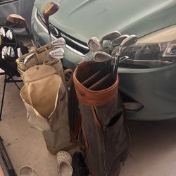 Two golf bags with clubs CHEAP