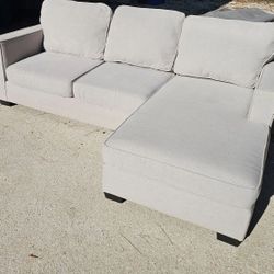 Living Spaces Egan II Reversible Chaise Sofa in Cement Gray