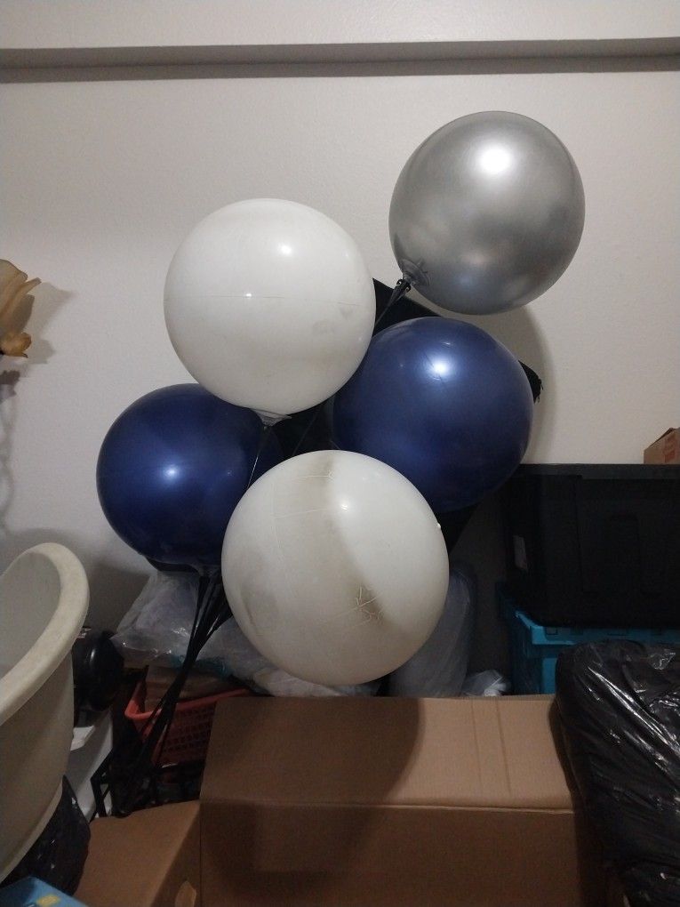 One silver balloon two blue balloons and two white balloons total willows five