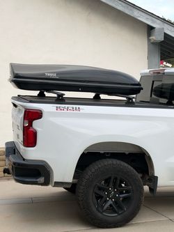 Retrax Pro MX  bed cover W/ rhino rack bars and Thule carrier