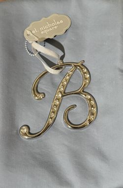 St. Nicholas square diamond accented cursive B