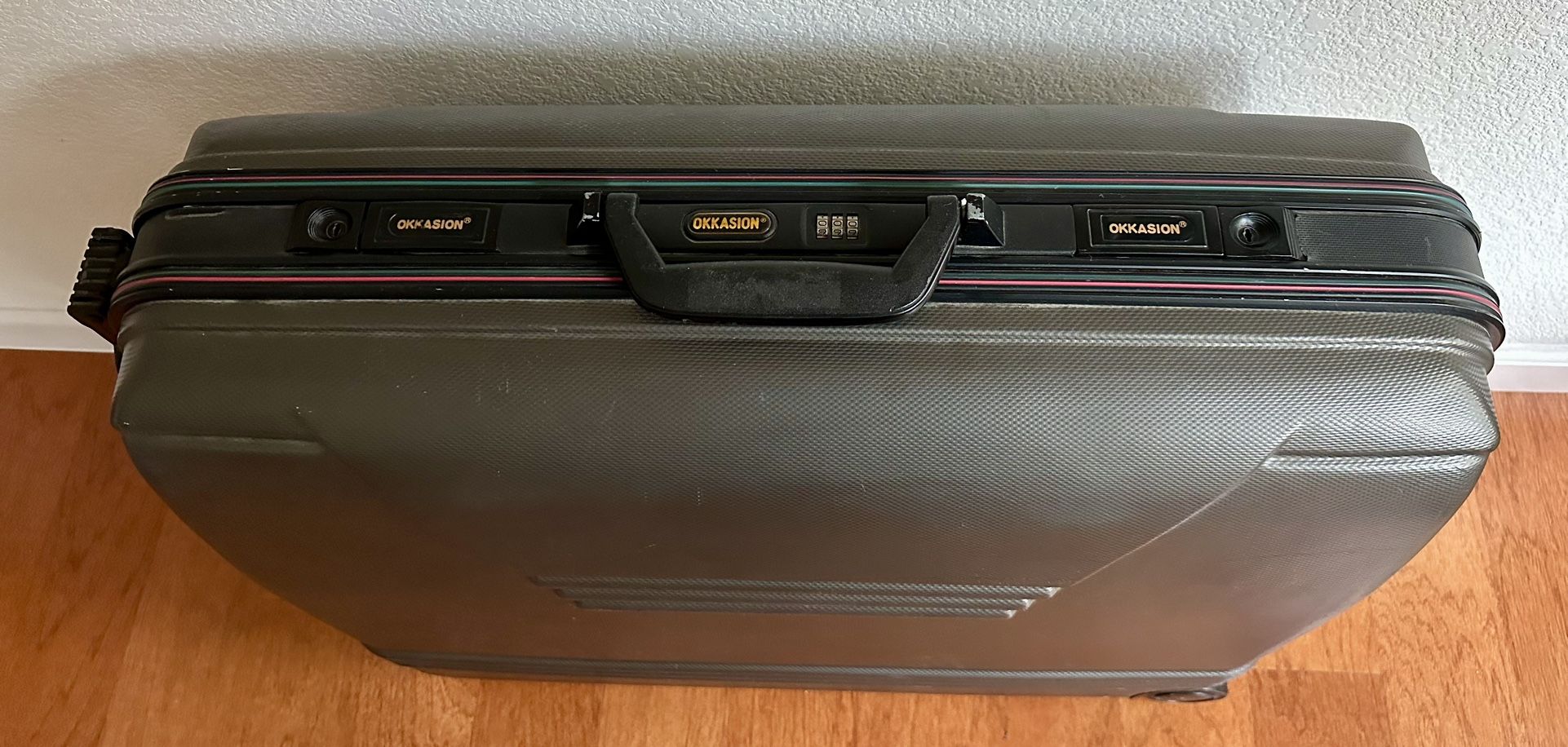 ~~OKKASION Hard Shell Luggage– Excellent condition, used once for a national trip. Clean inside, durable case, combo lock & smooth wheels.
