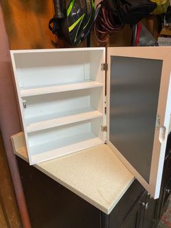 Medicine cabinet with a mirror door,