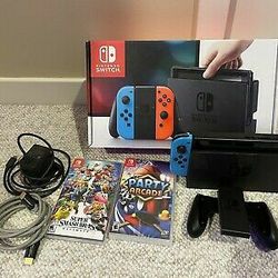 USED NINTENDO SWITCH WITH 2 GAMES (Super Smash Bros Ultimate and Party Arcade)

