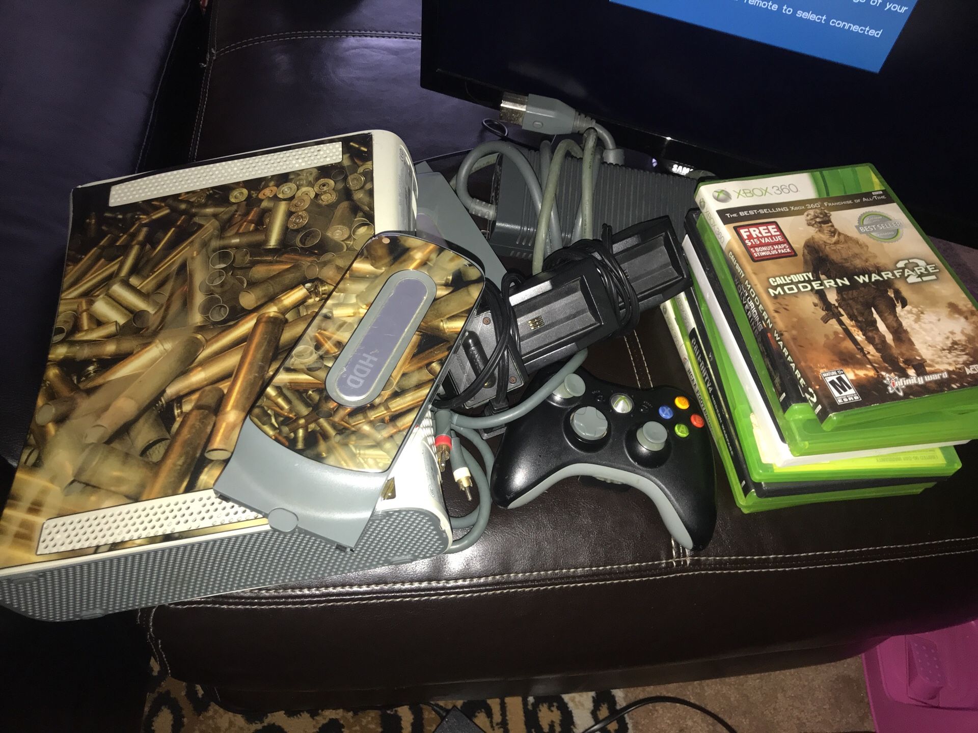 Xbox 360, two hard drives, 12 games, one controller, batteries rechargeable thing