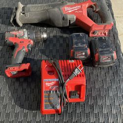 Milwaukee Sawzall And drill. 2 5.0 Batteries 