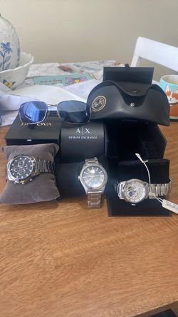 bulova 2 y un armani unos lentes Ray ban