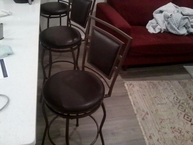 Three Brown Bar Stools