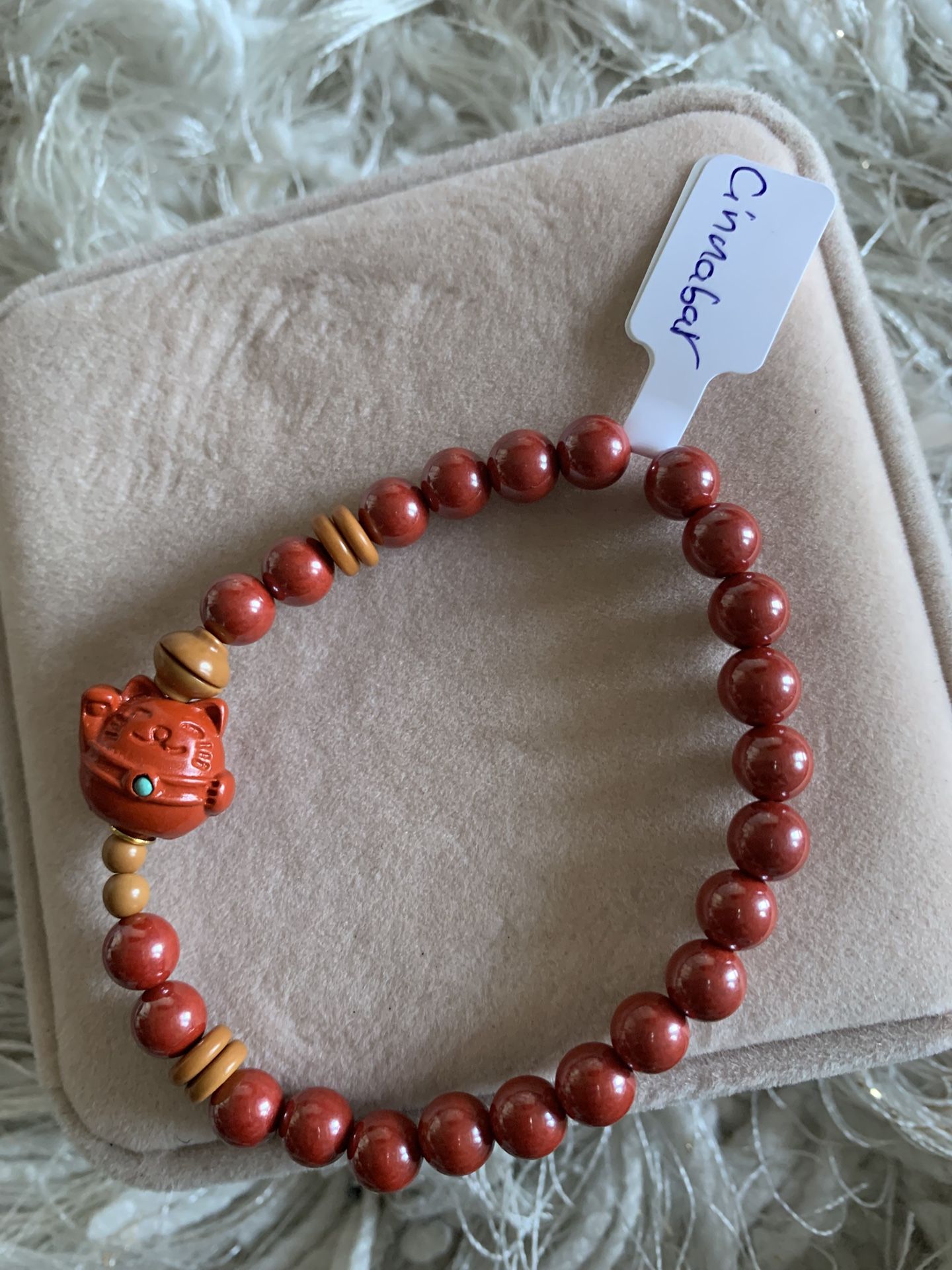 Beautiful red cinnabar bracelet with lucky cat charm