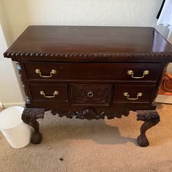 Solid brown wooden dresser with golden handles