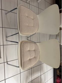 2 White chairs with  cushions