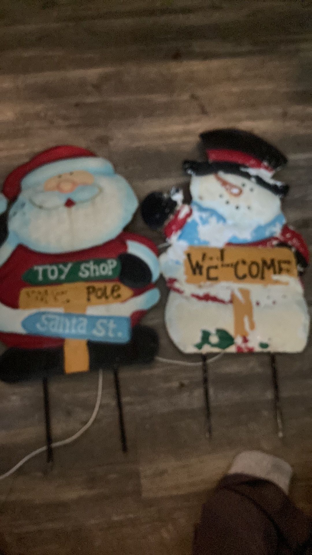 Two metal yard ornaments