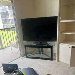 55 inch Sharp television with a TV stand can be delivered for $30 in Palm Beach County.