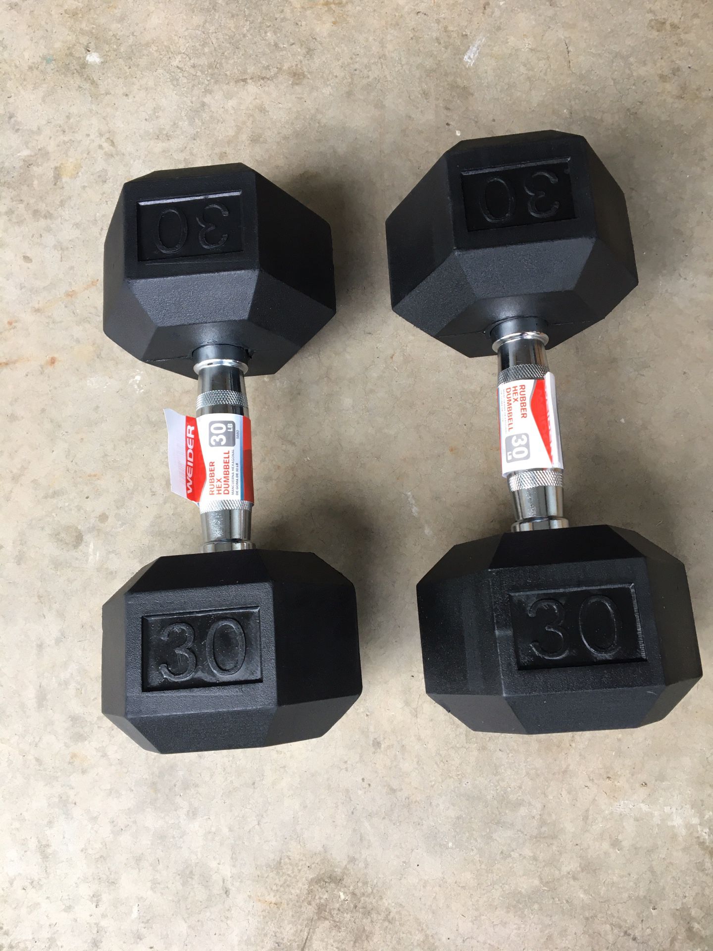 Delivery available. Pair of 30lb rubber coated hexagon dumbbells. 60lb total weight. These are brand new and have never been used. $135firm