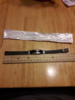 Black wrist band. (New).