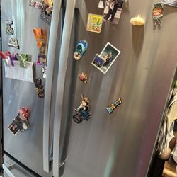 General Electric Wide French Door Refrigerator with Ice Maker with Water Dispenser