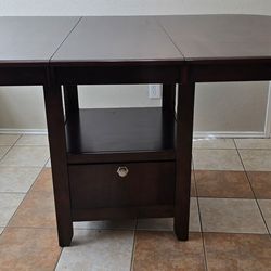 Ashley Furniture Drop-leaf / expandable console dining table with storage