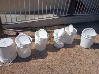 Clean white buckets with lids