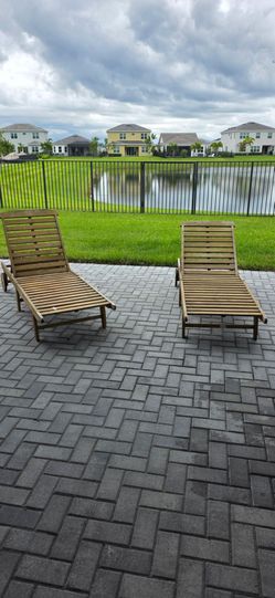 Two wooden lounge chairs $100