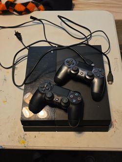 Sony PlayStation 4 Console with Two Controllers