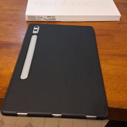 Galaxy Tab S9 + with a black cover and a pen