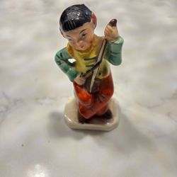 Japanese boy playing an instrument vintage