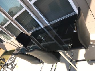 Glass dining table with four chairs (4)