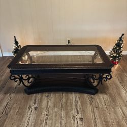Elegant Glass Coffee Table with Decorative Iron Legs
