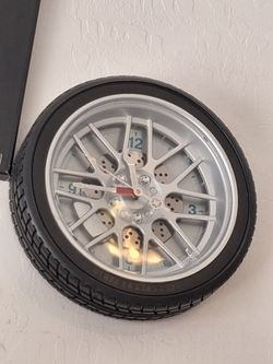 A wall tire looking clock works perfect for your shop