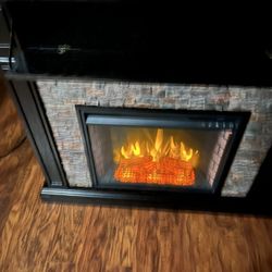 Electric fireplace with blower and temperature control