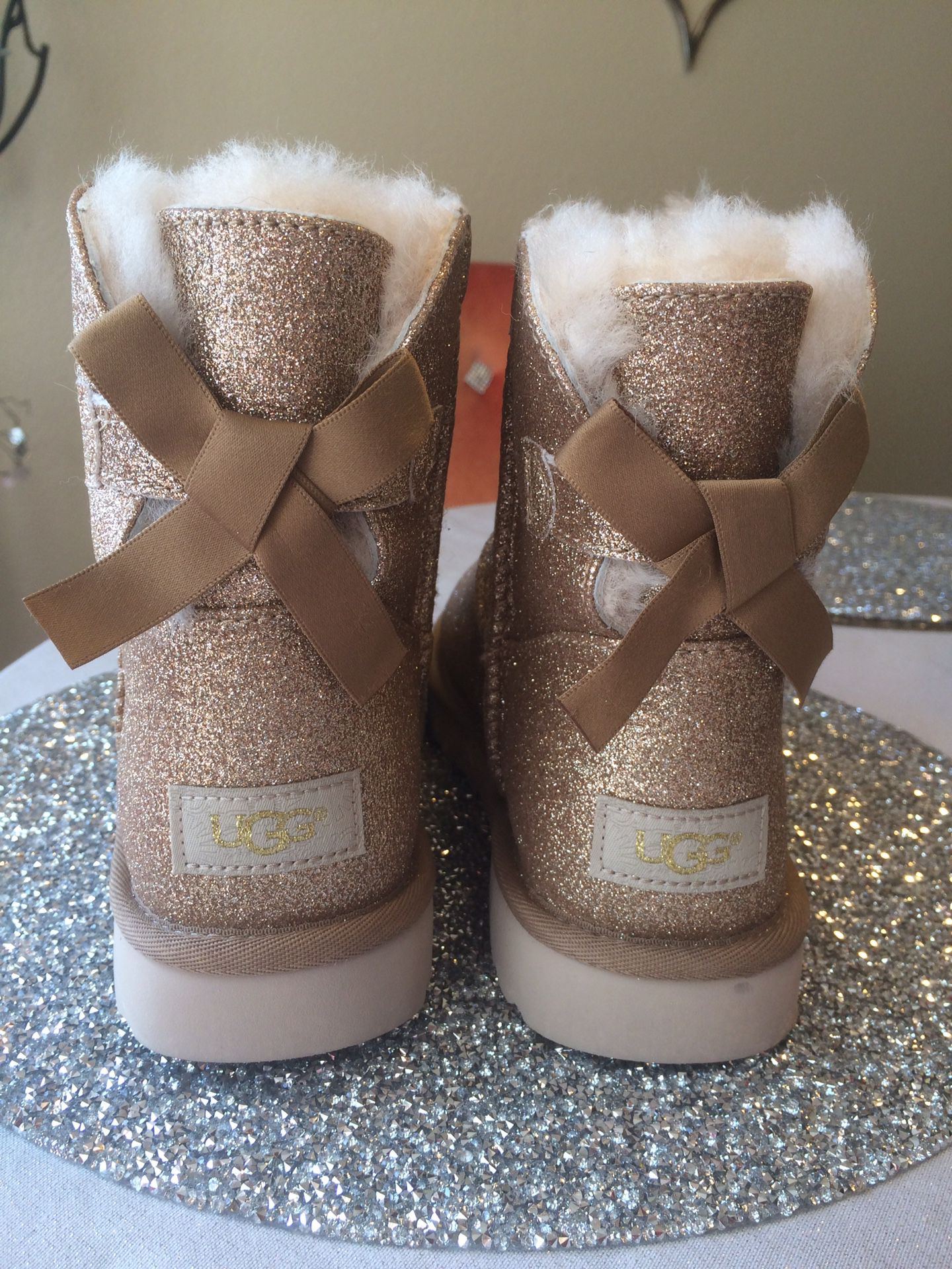 Brand new UGG mini bow sparkle glitter boots booties shearling fur lined size 8 NEW gold $100 100% authentic