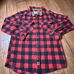 Legendary Whitetails Navigator Fleece Button-Up Shirt, featuring a red and black plaid design, a corduroy-lined collar, and a signature logo patch Lar