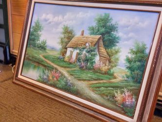 Framed painting of cottage