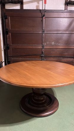 Classic two toned walnut round dining table