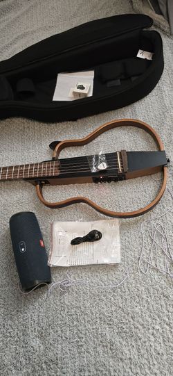 Portable Sonicake DST-01 travel guitar has a unique silent frame design with a natural wood finish. This electric travel guitar is made with a mahogan