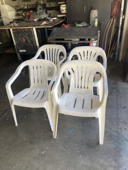 Four Stackable Chairs.