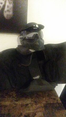 A paintball backpack with the helmet it holds two tanks paintballs pockets for days anything extra