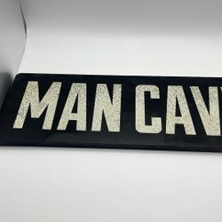 Mane Cave Sign 