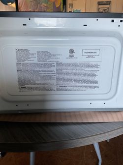 Kenmore 1.1 cubic foot capacity 1000 watts of power Black microwave Easy to read digital LED display 10 power levels Glass turntable Interior light