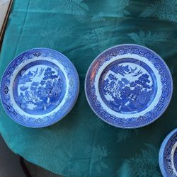 Eleven Blue Willow dinner plates made in England