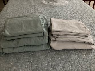 2 sets of queen size sheets - (never used)