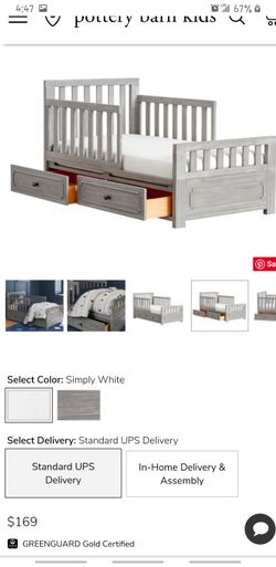 Gray todler bed with matress