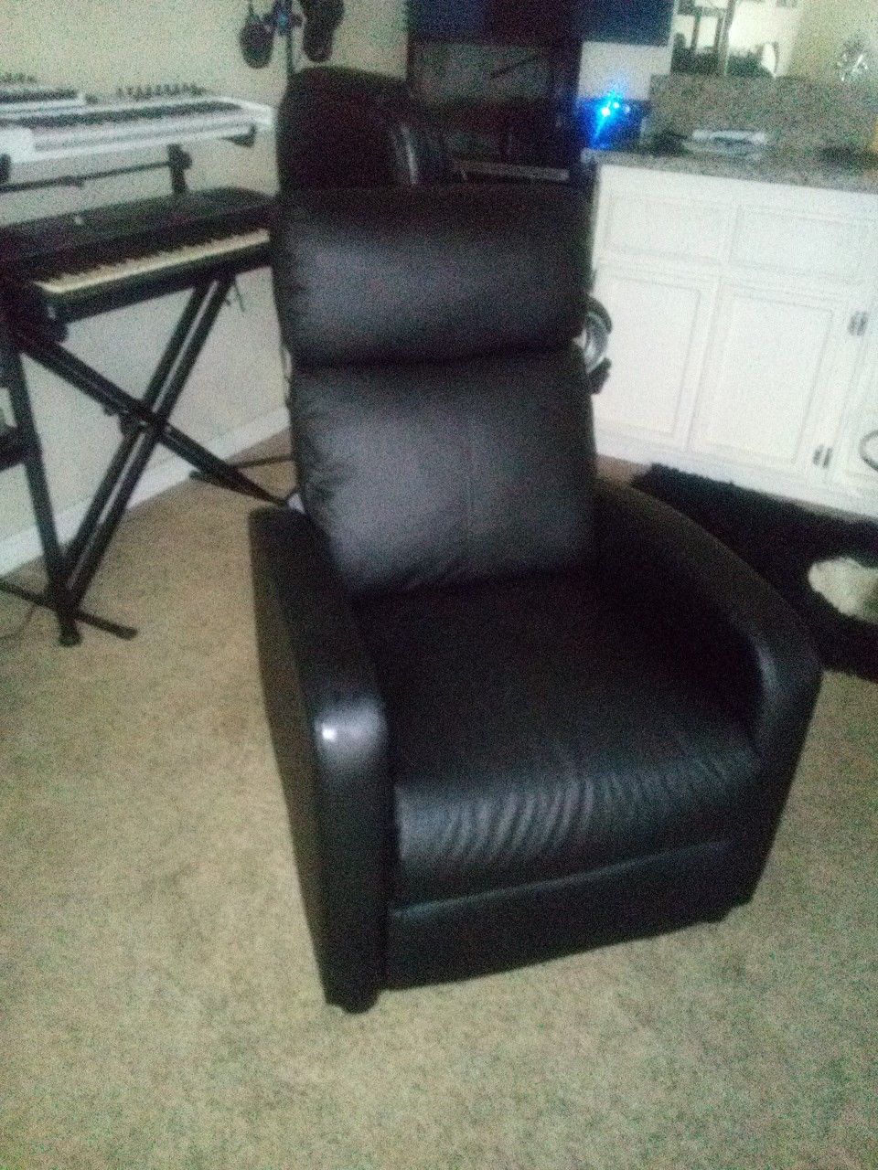 Black Faux Leather Recliner .