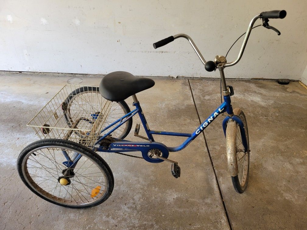 Adult Blue 3 wheel bicycle. Cignal village velo.