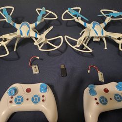 2 Drones 2 Controllers 2 Batteries 1 Charger