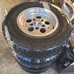 CHEVY OBS RIMS AND TIRES 235/75/15 KELKY EDGE AT TIRES 5 LUGS 