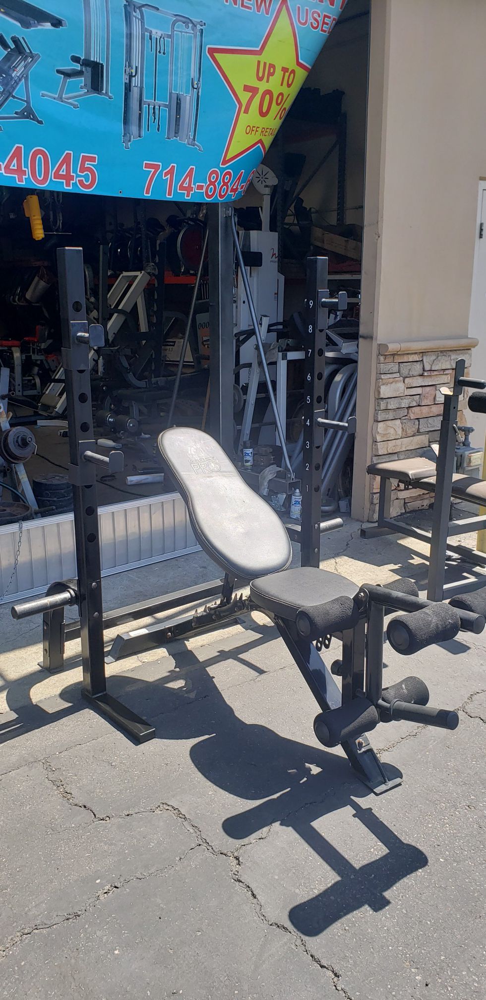 Squat rack/bench press with bench, bar and weights